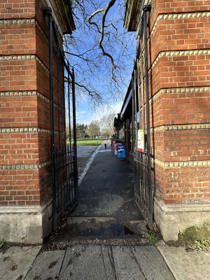 Final preceding gate before venue. Push in centre to open. Venue along right after gate.