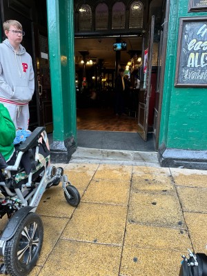 Entrance with slight bump and wide doors with glass which open outwards