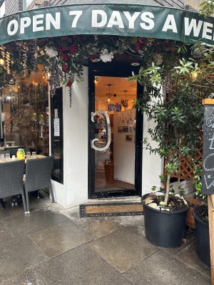 View of the entrance door. The handle is located on the left hand side, the door opens to the outside.