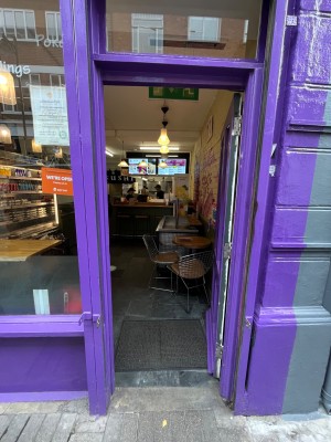 Push purple door handle on the left.