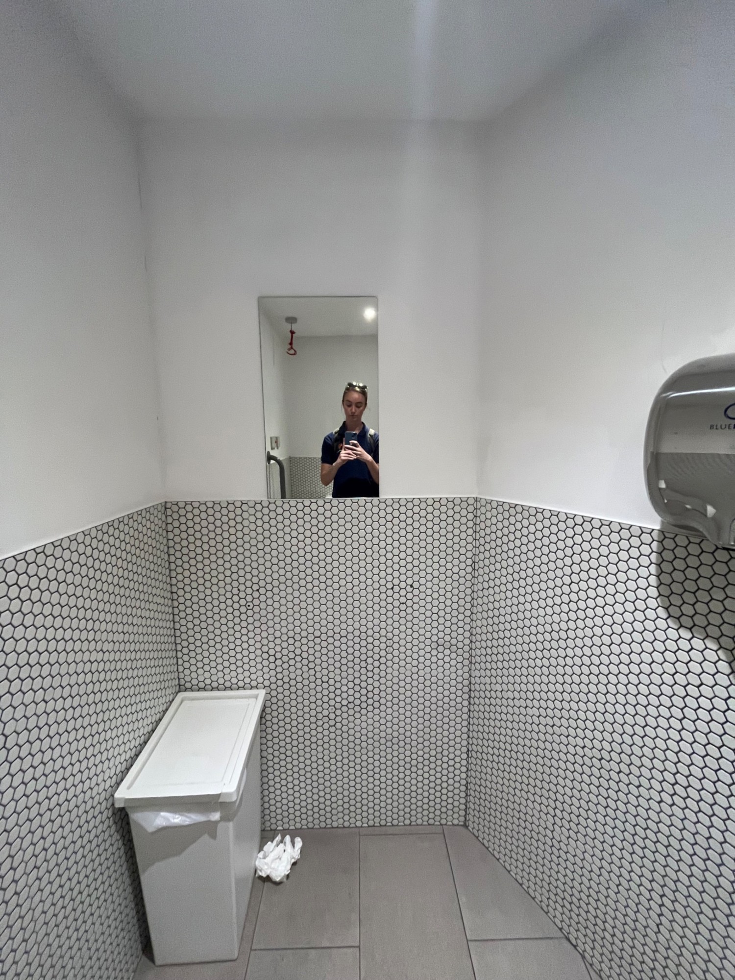 From sink facing right. Mirror on back wall ahead.