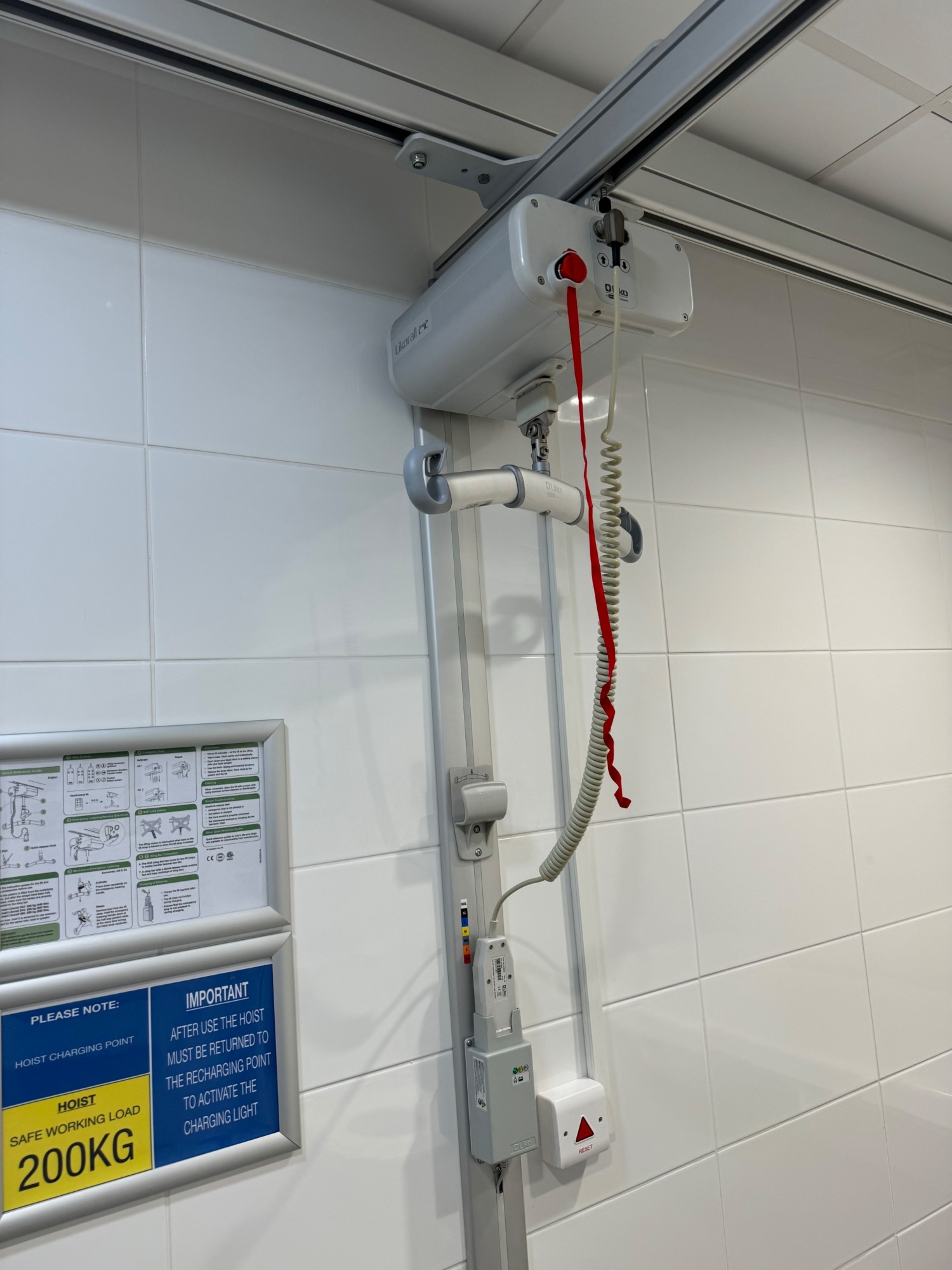Ceiling track hoist on it’s charge station