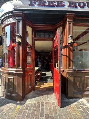 Wood and glass panelled door. Pull open from left.