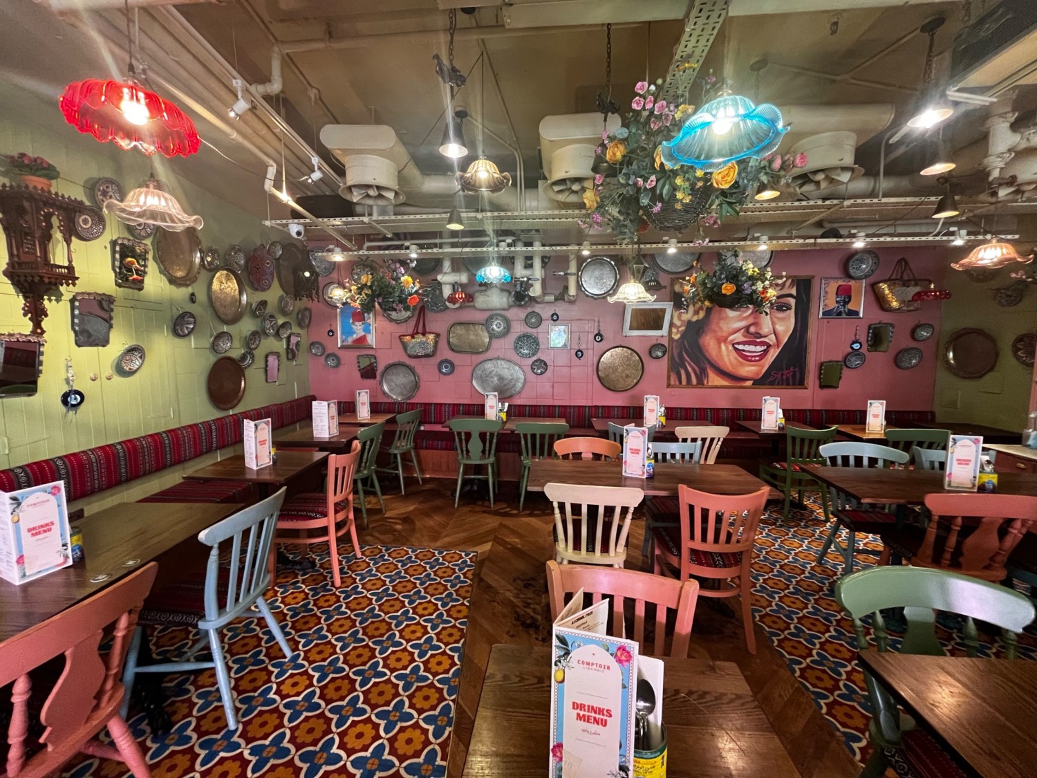 From half booths facing right. Half booths along left and back wall. Chairs ahead to the right.