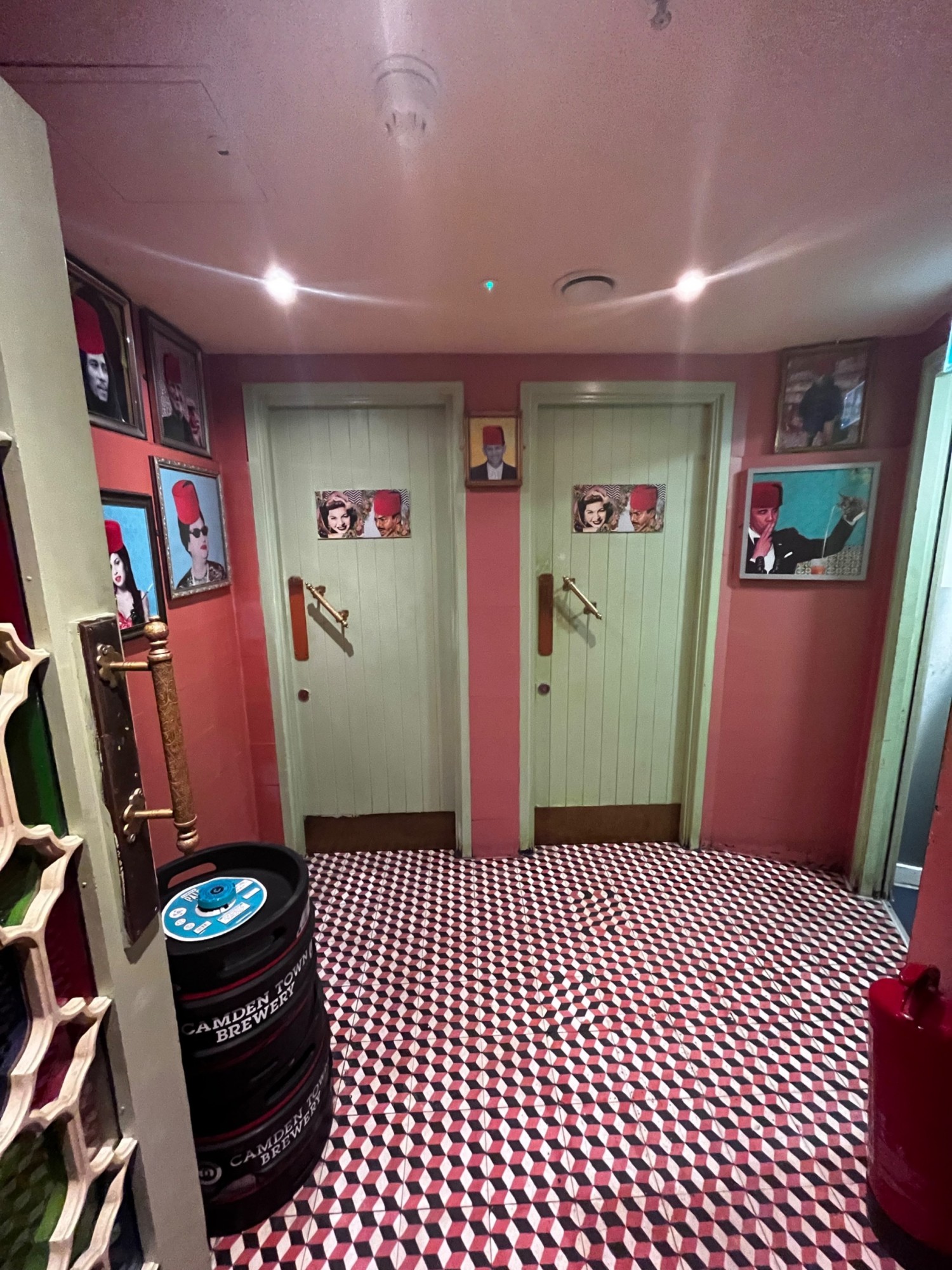 From corner of open kitchen facing right. Path ahead to two toilet doors along back wall