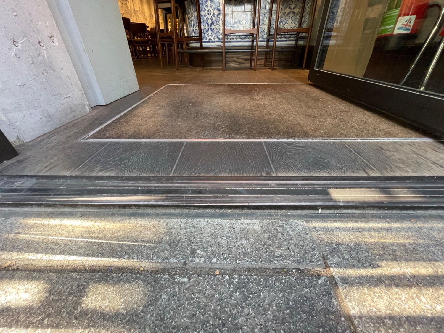 Metal bump at centre of doorway.