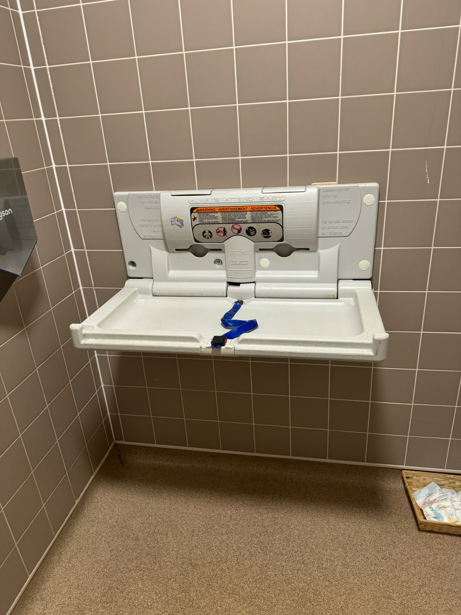 Baby change table with a safety strap