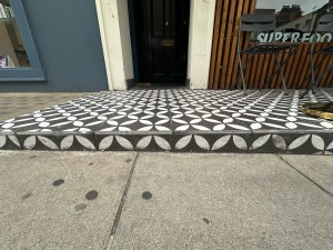 1 step up before entrance and outdoor seating area.