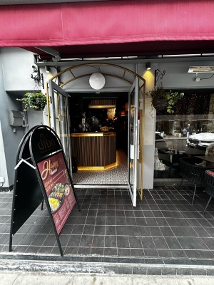 Entrance glass door ahead. Silver handles on the middle. Pull to open