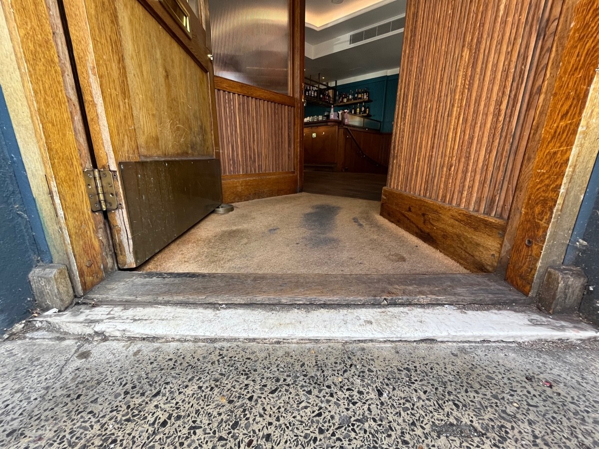Small bump followed by carpet at foot of door.