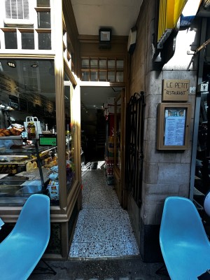 Entrance glass door with wooden frames. Lock on mid left. Push to open