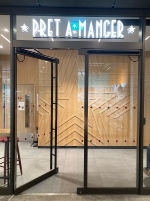 Alternative access via double glass door with metal frame on the back of the venue. Push open via metal vertical handrails in center.