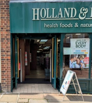 Front entrance.
Double doors.
Manual pull to open.
A board sign outside shop by the entrance.
Level access.