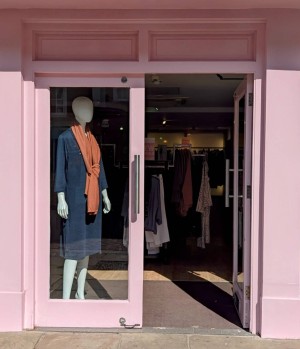 Front entrance.
Push to open manual doors.
May have mannequin inside door entrance.