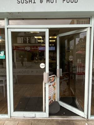 Light blue framed glass door. Push from centre open.