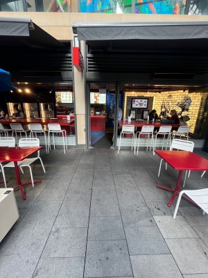 Path to door through outdoor front seating.