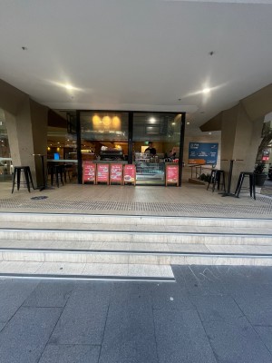 Four steps up to service counter. No door.