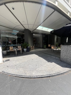 Path to door from street. Door ahead slightly to right through outdoor front area.