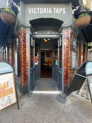 Double wooden and glass doors ahead. Pull to open from centre. Sandwich boards on both sides of doors.