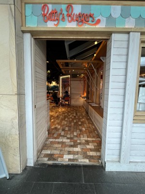 Cream wooden door slides open to left.