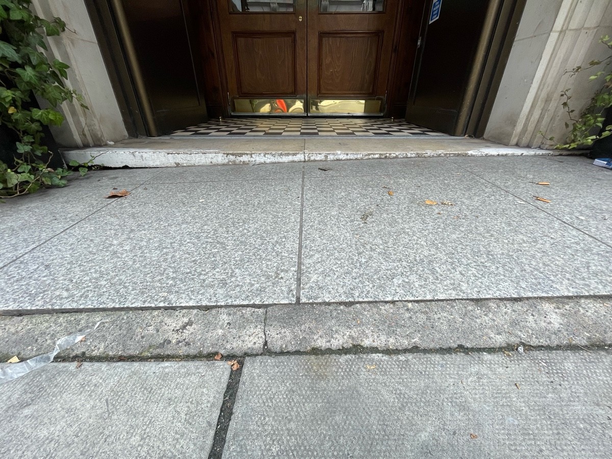 Small bump at start of path. Uneven path ahead.