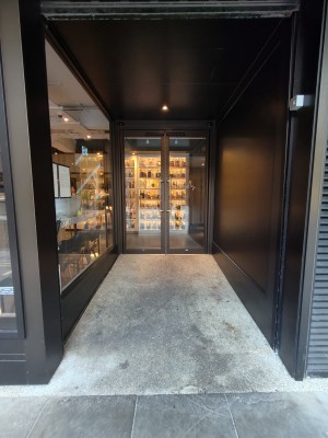 Facing entrance. Built-in ramp ahead to doors at back.