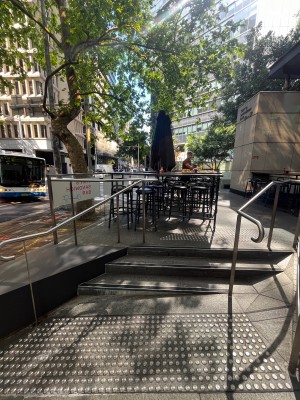 Staircase up to entrance. Ramp on right of staircase.