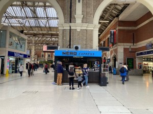 From inside station, facing venue. Kiosk venue ahead.
