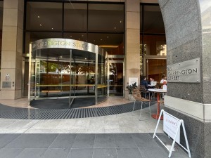 Path to entrance from street. Accessible entrance ahead to right. Path continues facing right through outdoor front area.
