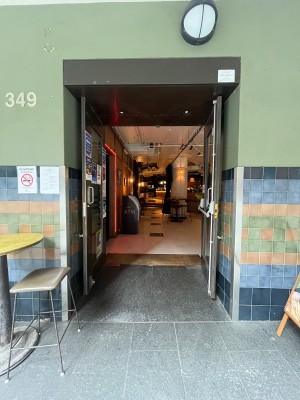 Glass double doors with grey wooden frame. Pull from middle.