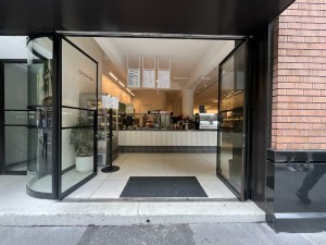 Glass double doors. Push from middle to open.
