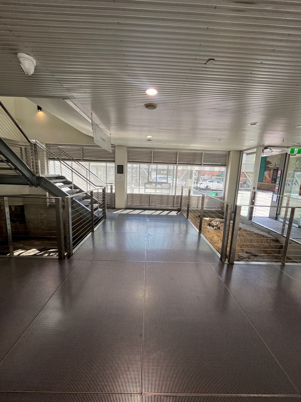 From path to stairs after turning right. Staircase on left wall ahead.