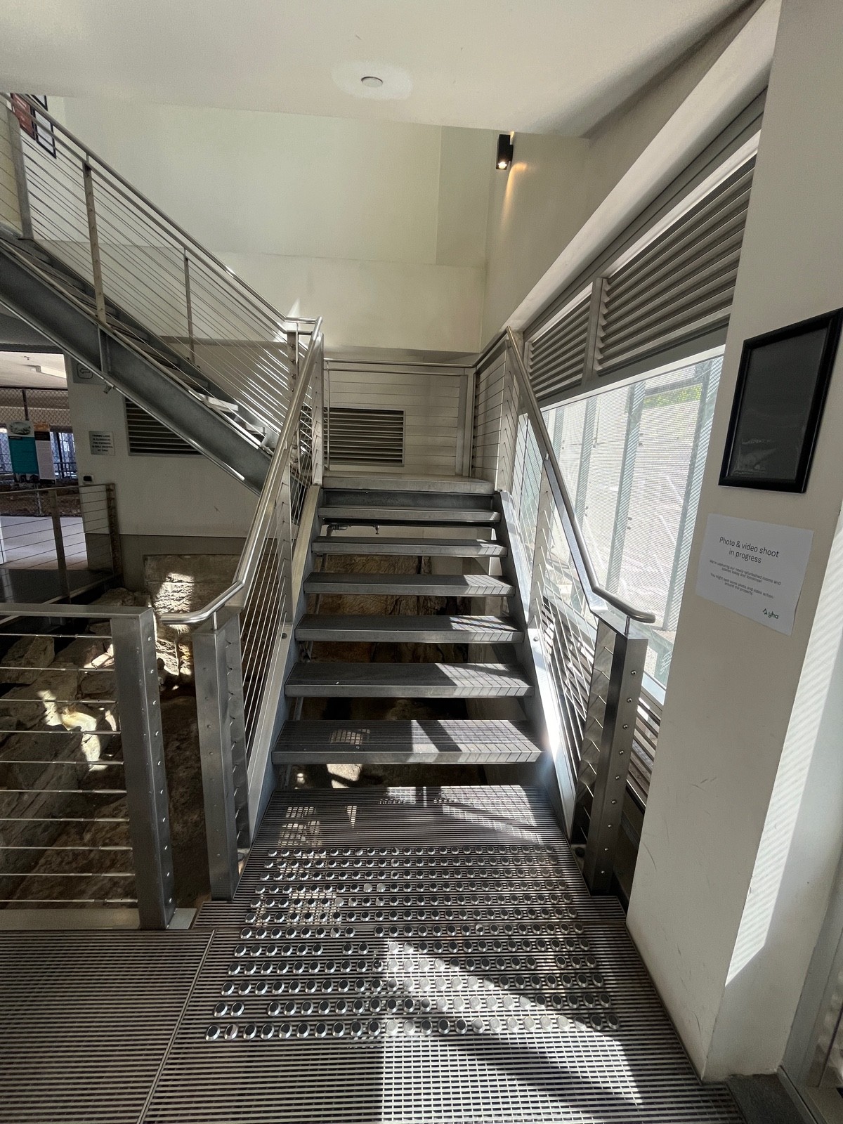 Staircase to upstairs. 7 steps to landing. Handrails either side. Tactile flooring before steps.