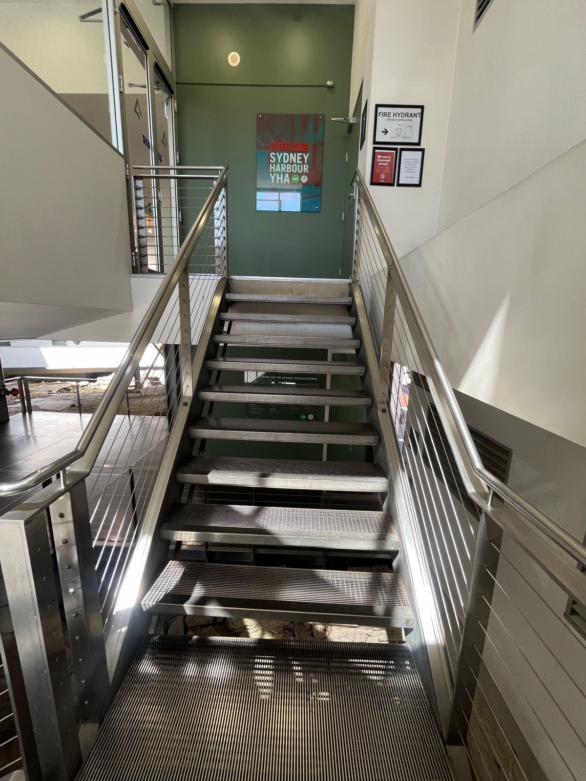 From landing facing left. 10 steps to floor. Handrails either side.