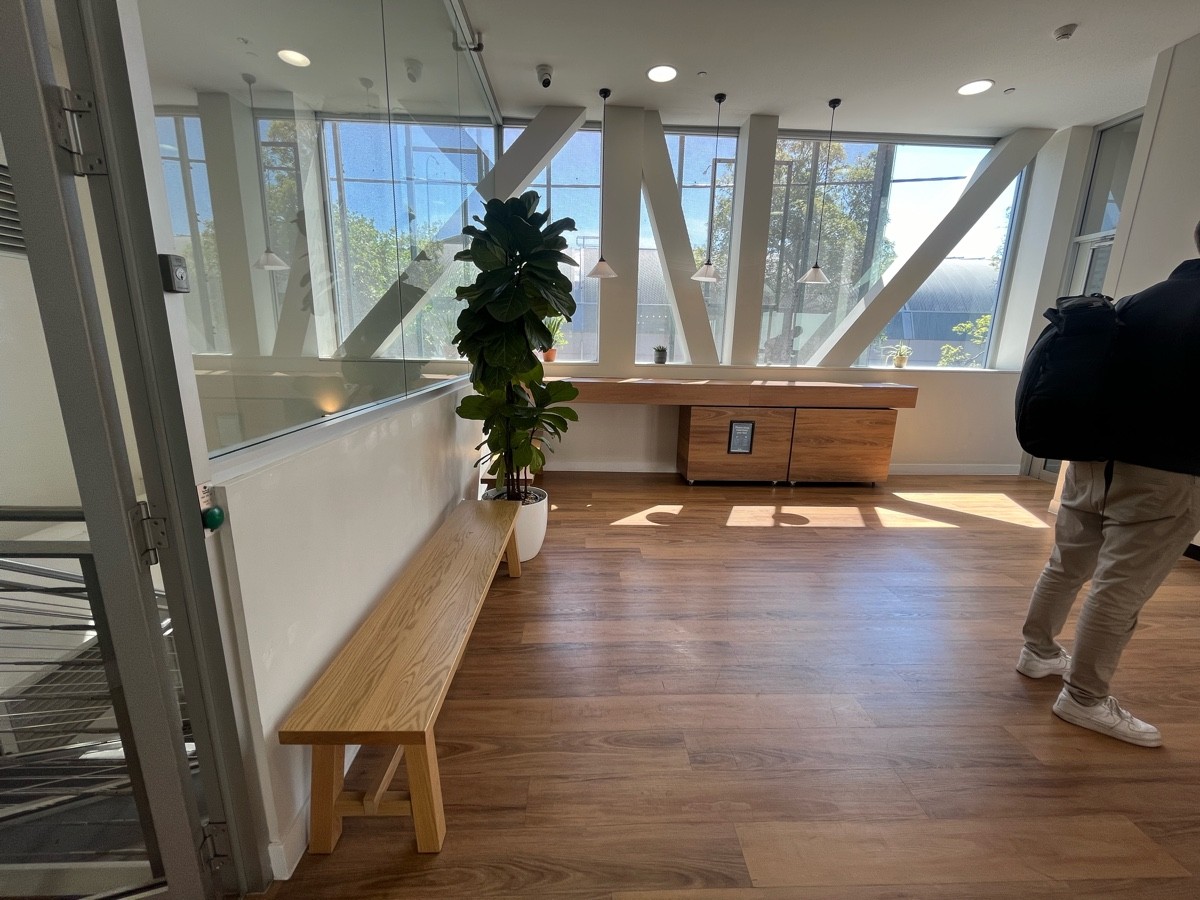 From entrance facing left. Waiting area bench on left wall.