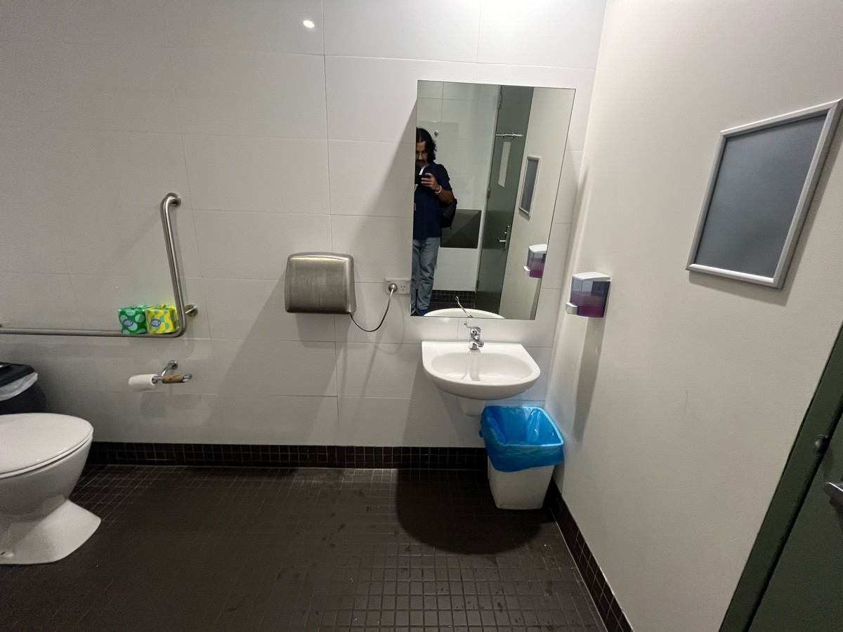 From door facing right. Sink on wall ahead.