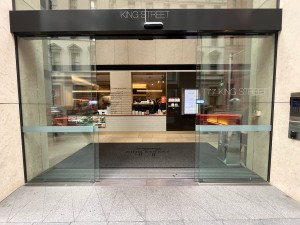 Glass double doors slide open from middle.