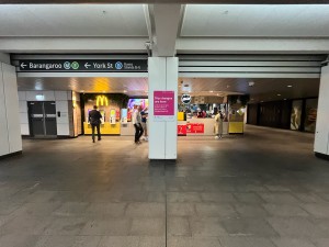 Open archways leading to service kiosk. Pillar dividing archways in middle.