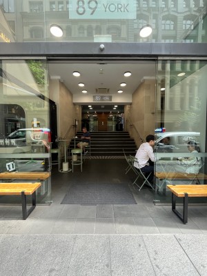 Glass double doors slide open from middle automatically.