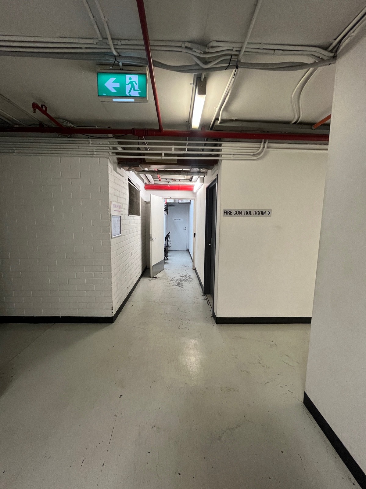 From lift exit facing right. Bathroom door on right wall ahead.