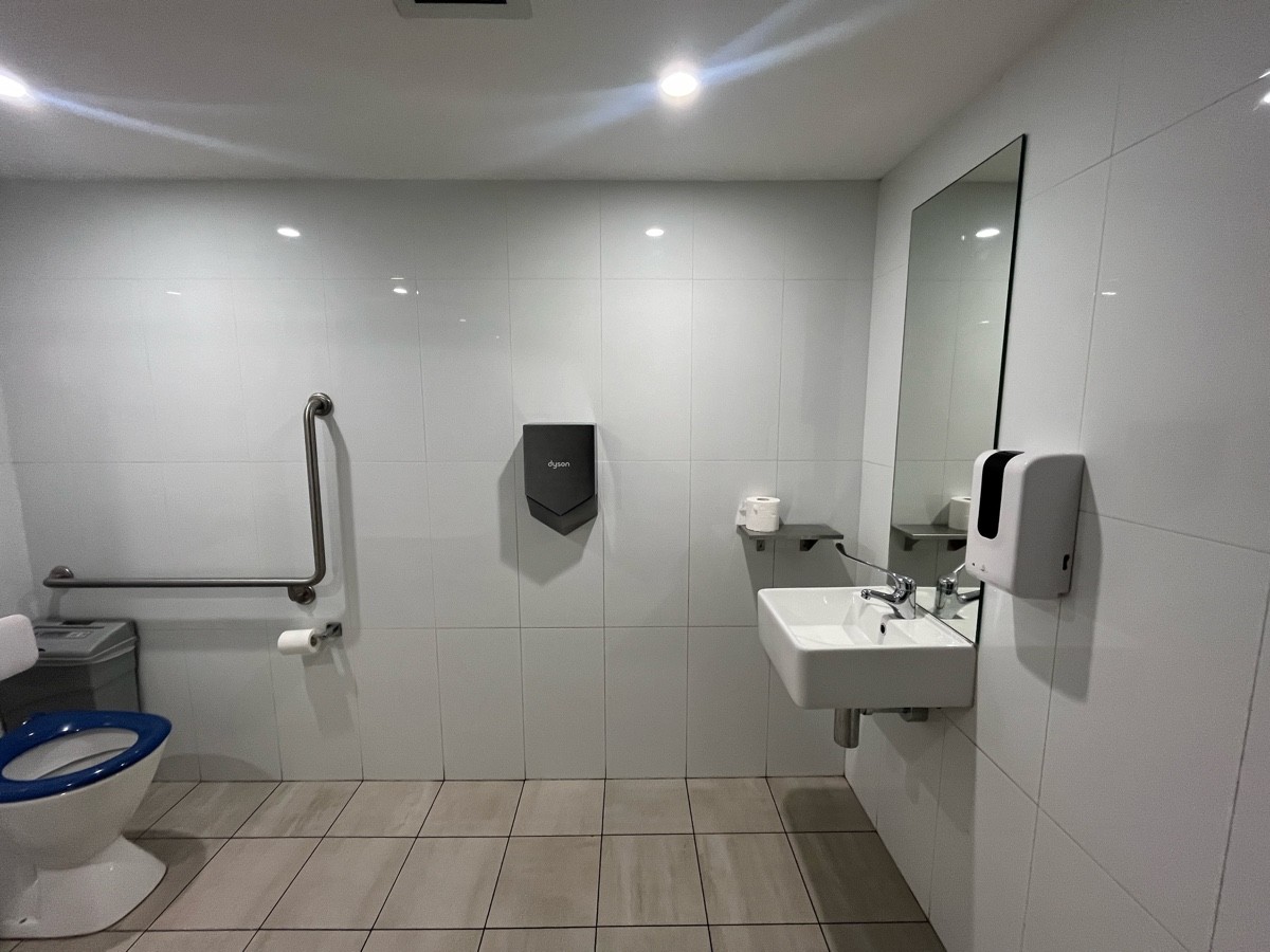 From door facing straight. Sink on right wall.