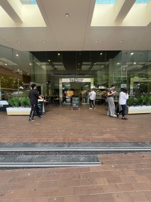 Two steps up to entrance level from street.