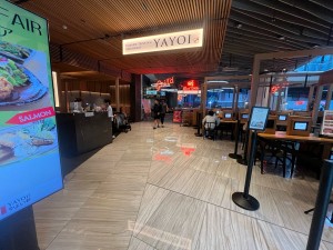 Path to entrance. Entrance on left wall before Grill’d restaurant ahead.
