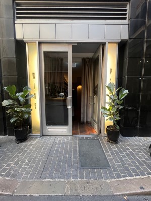 Glass double doors with silver metal frame. Push from middle.