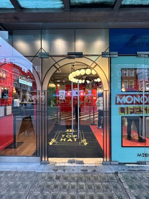 Patterned glass doors. Silver metal vertical handles in centre, push to open.