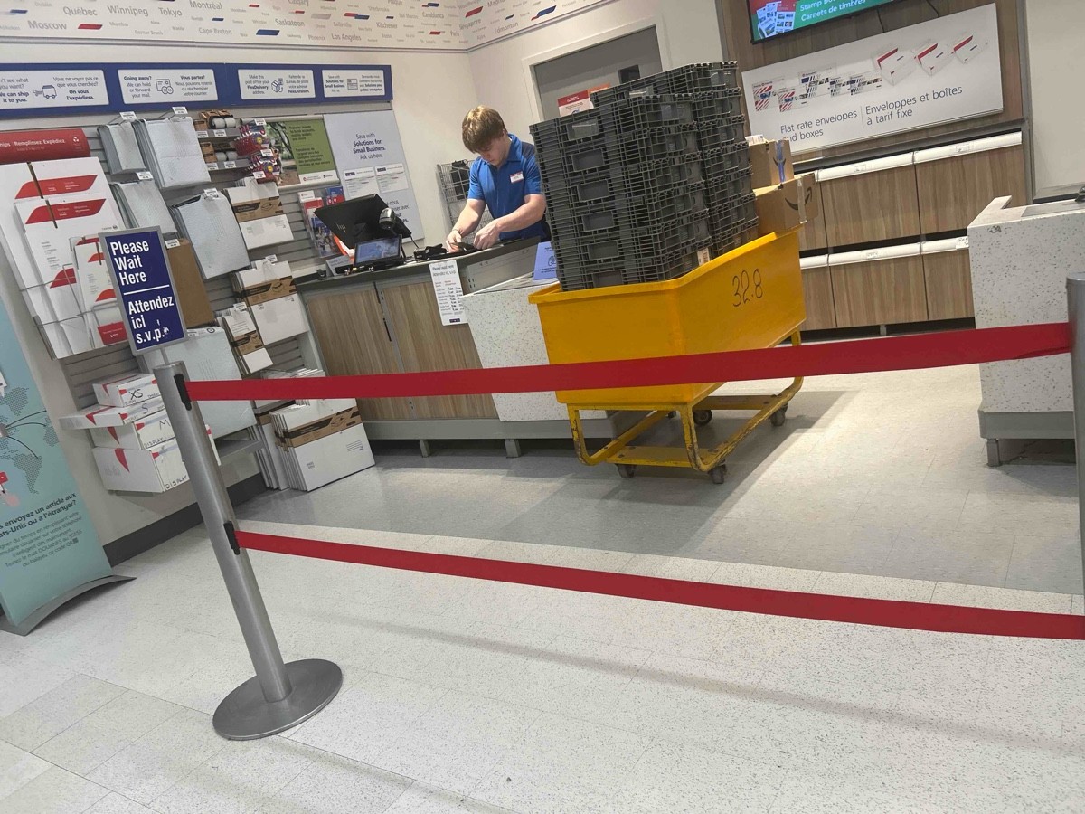 Canada Post in the back left corner of the store