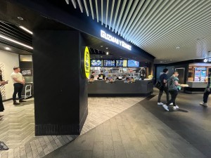 Open archway to venue. Pillar on left ahead.