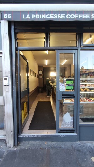 Glass doors with grey frames. Push grey handles in centre to open.