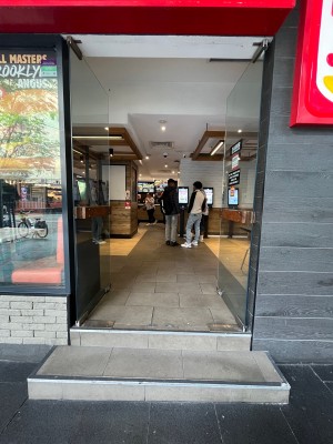 Glass double doors. Push from middle.