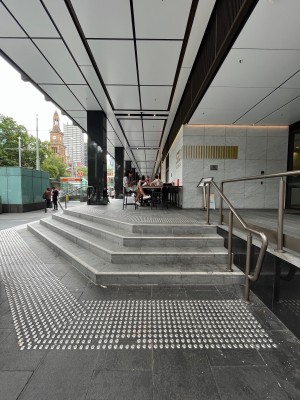 Staircase up to venue. 4 steps to floor. Handrail on right. Tactile flooring at both ends.